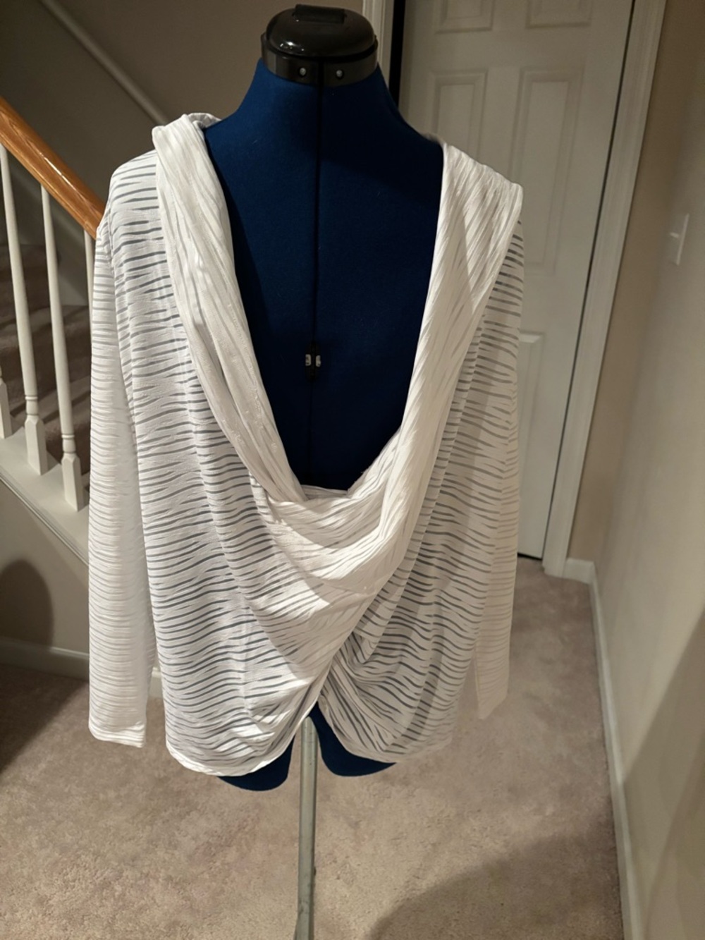 White draped top with front twist detail.